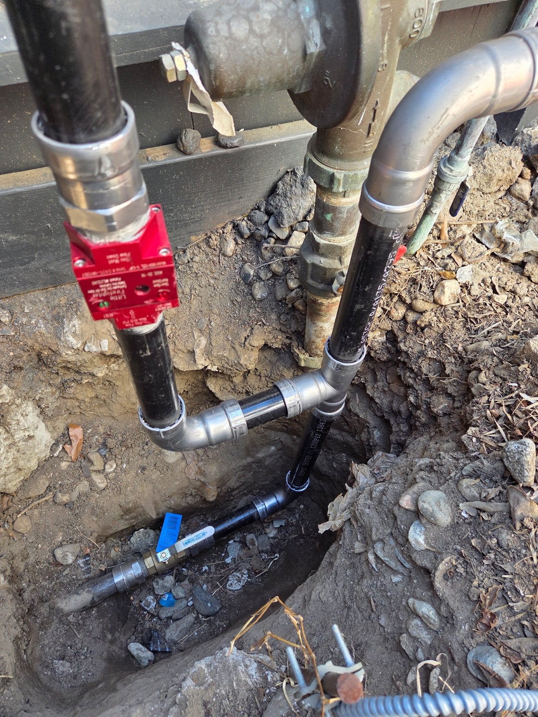 Replaced underground line with new gate valves before backfill