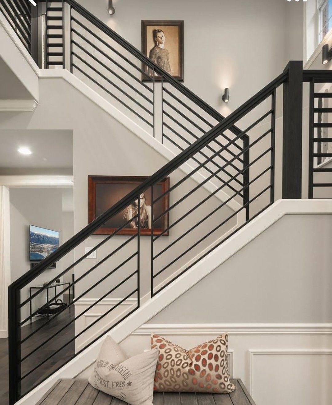 Finished staircase with modern horizontal railing