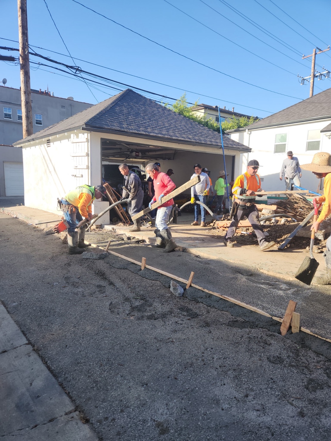 Crew setting forms in the street ahead of a pour