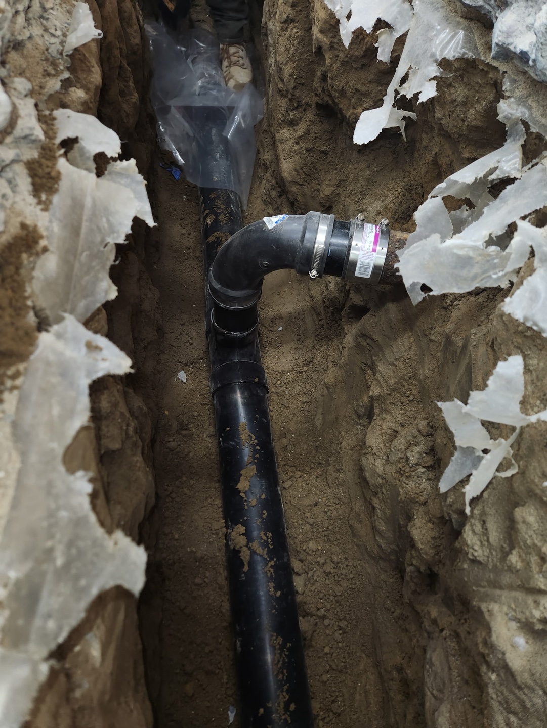 New sewer line laid in an open trench