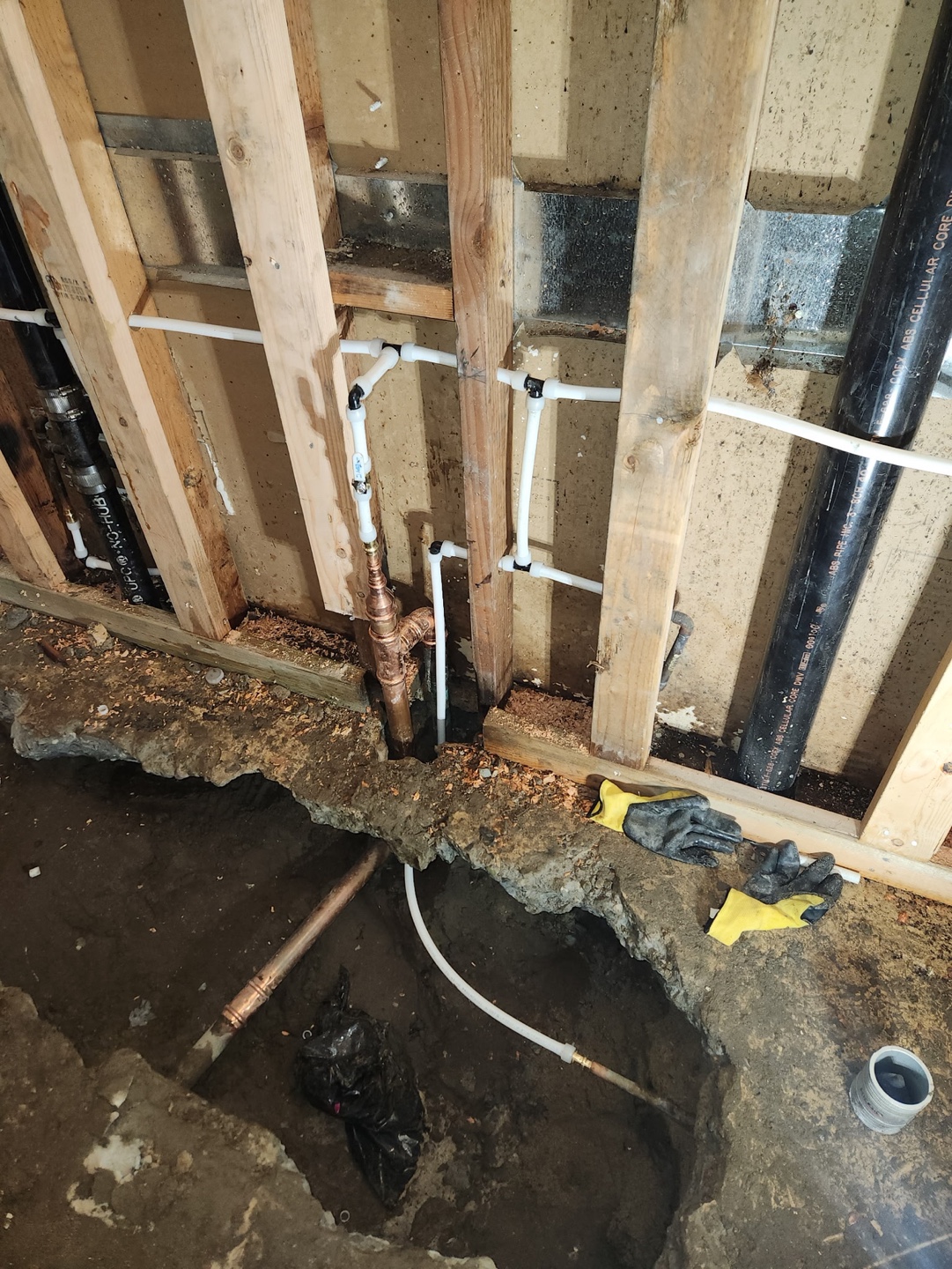 New supply lines run through open wall studs